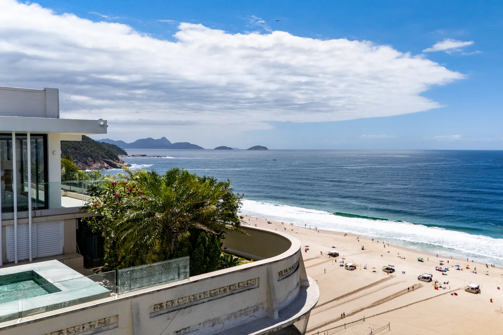 The curve of Copacabana beach toward the Leme headland, seen from the terrace