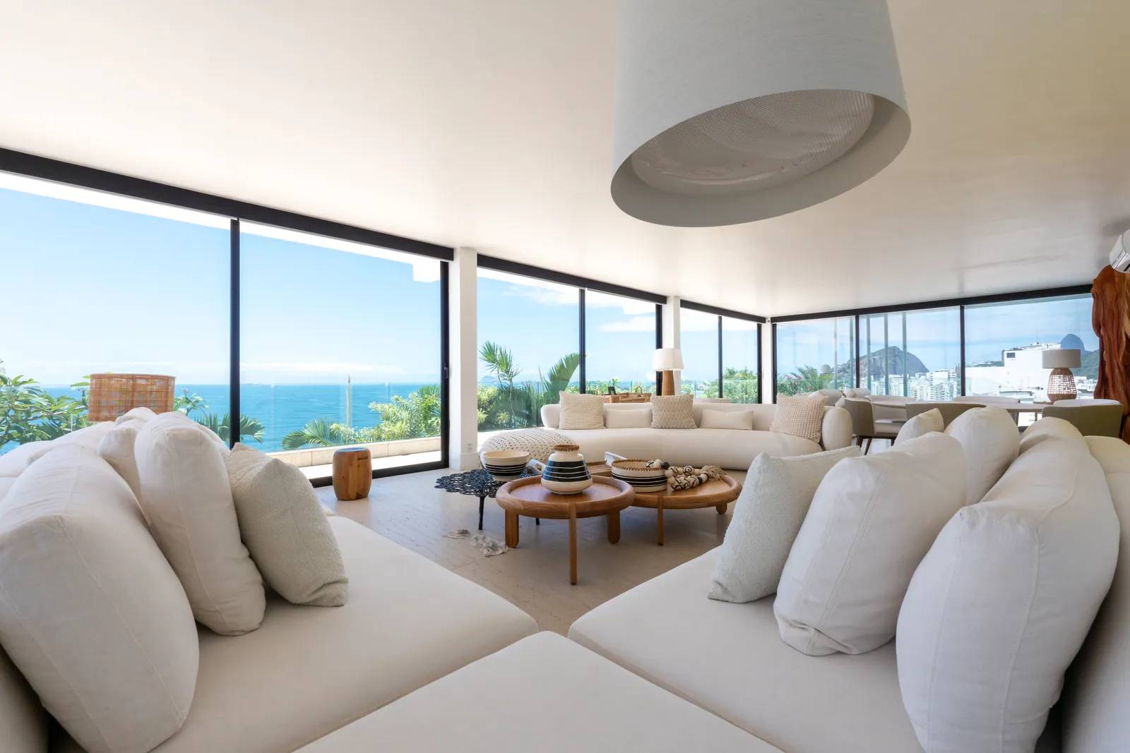 Living room seating running the length of the ocean-facing glass