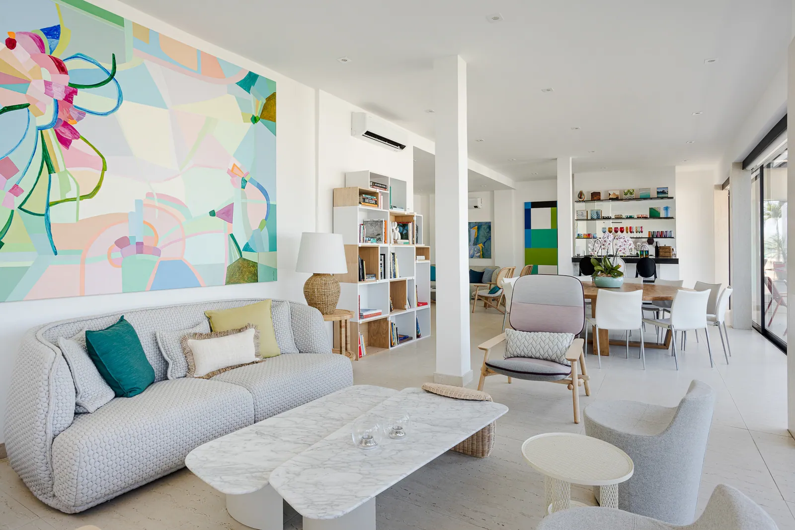 Living room with floral canvas and full-height bookshelves