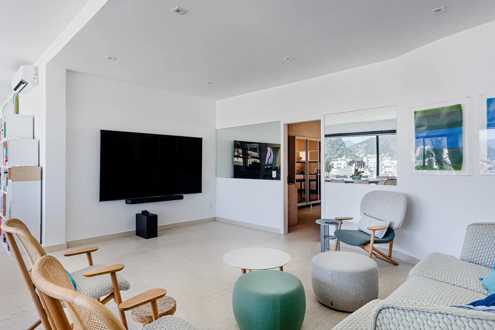 Television lounge with rocking chairs and low stools