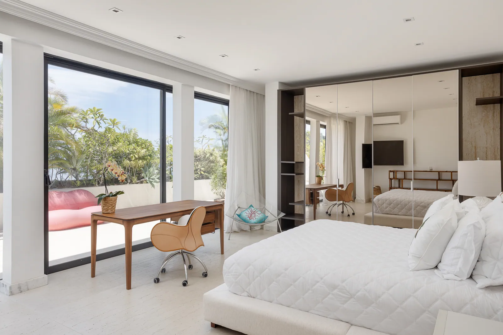 Bedroom with writing desk opening onto a private terrace