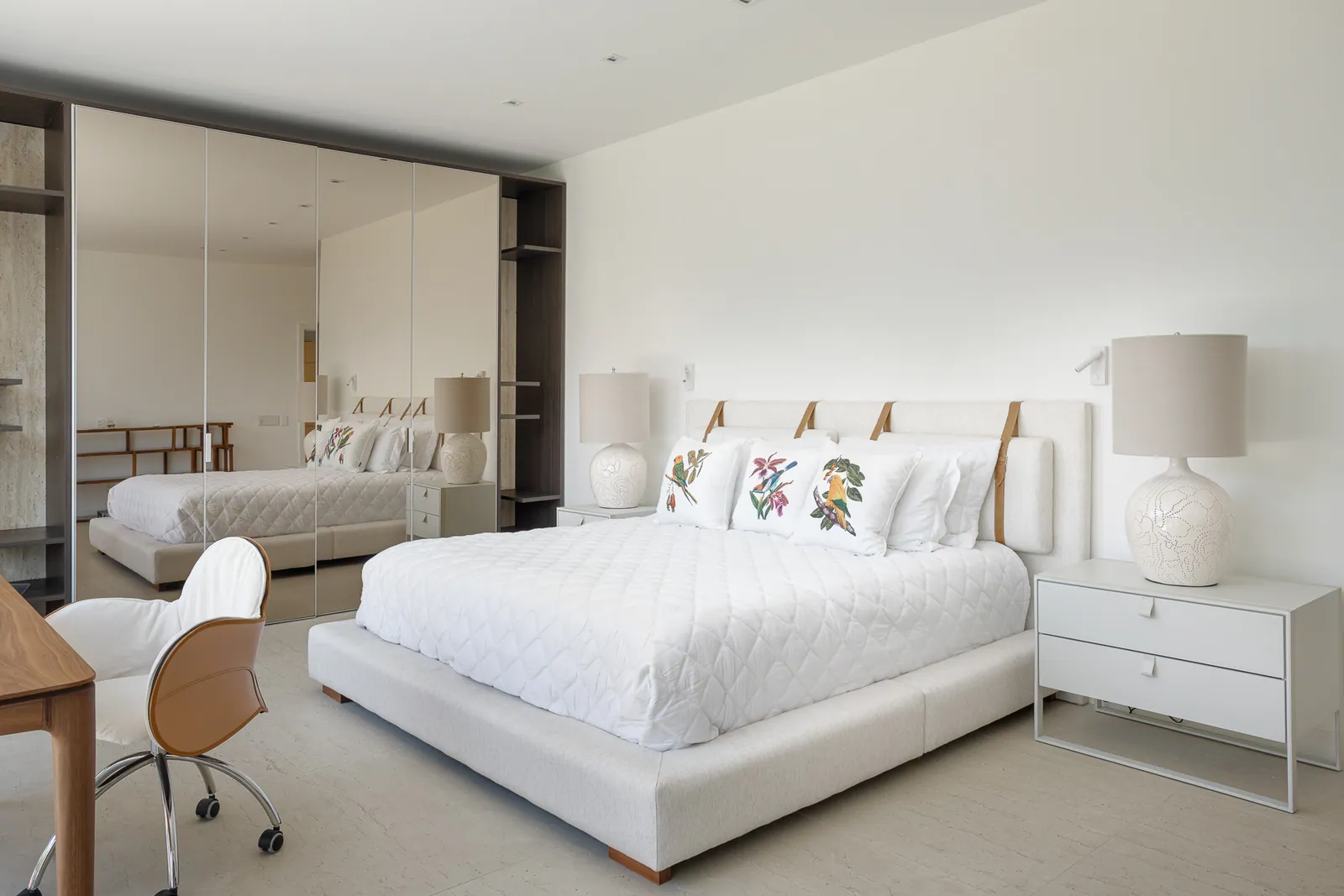 Bedroom with desk and full-height mirrored wardrobe