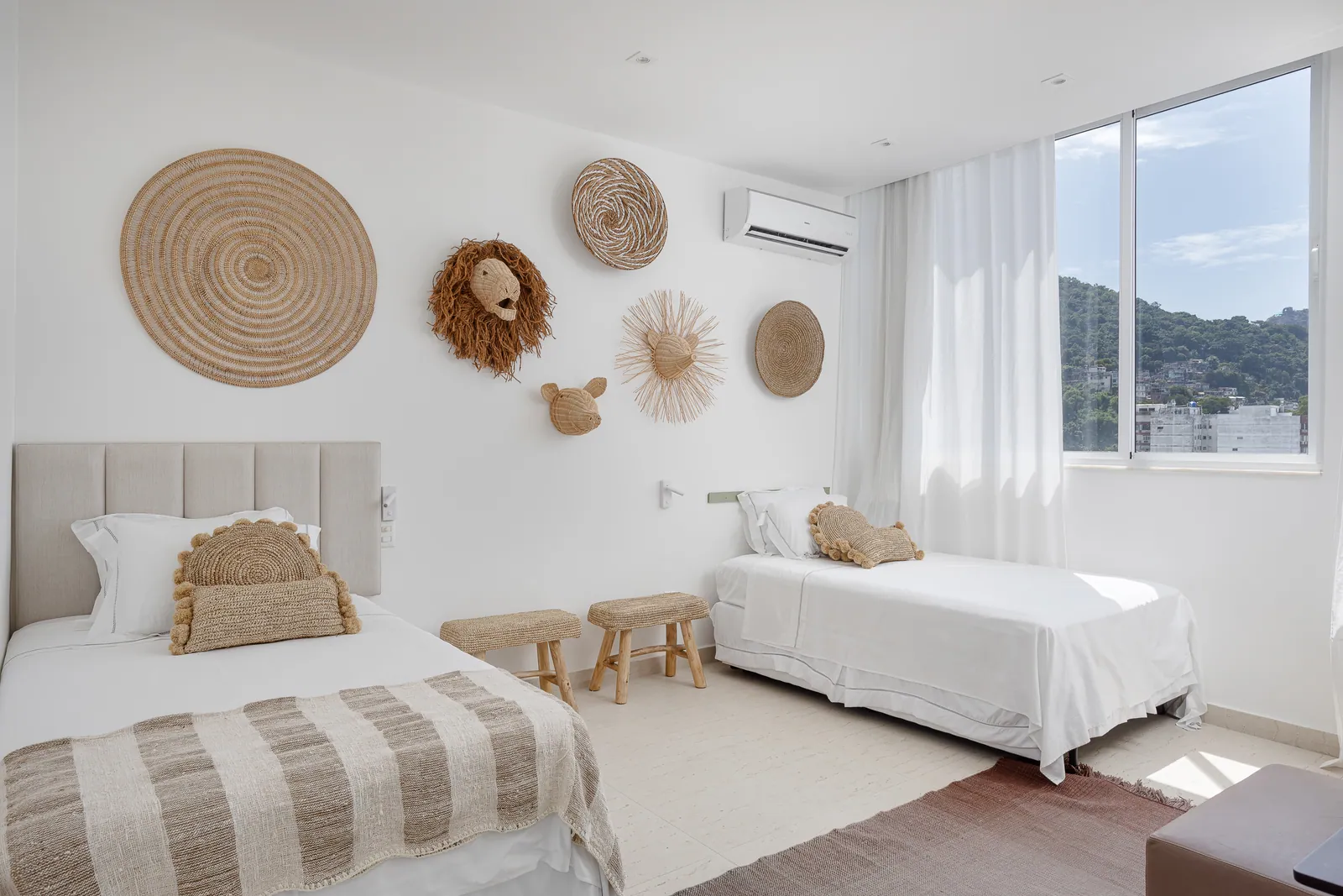 Twin bedroom with woven wall discs