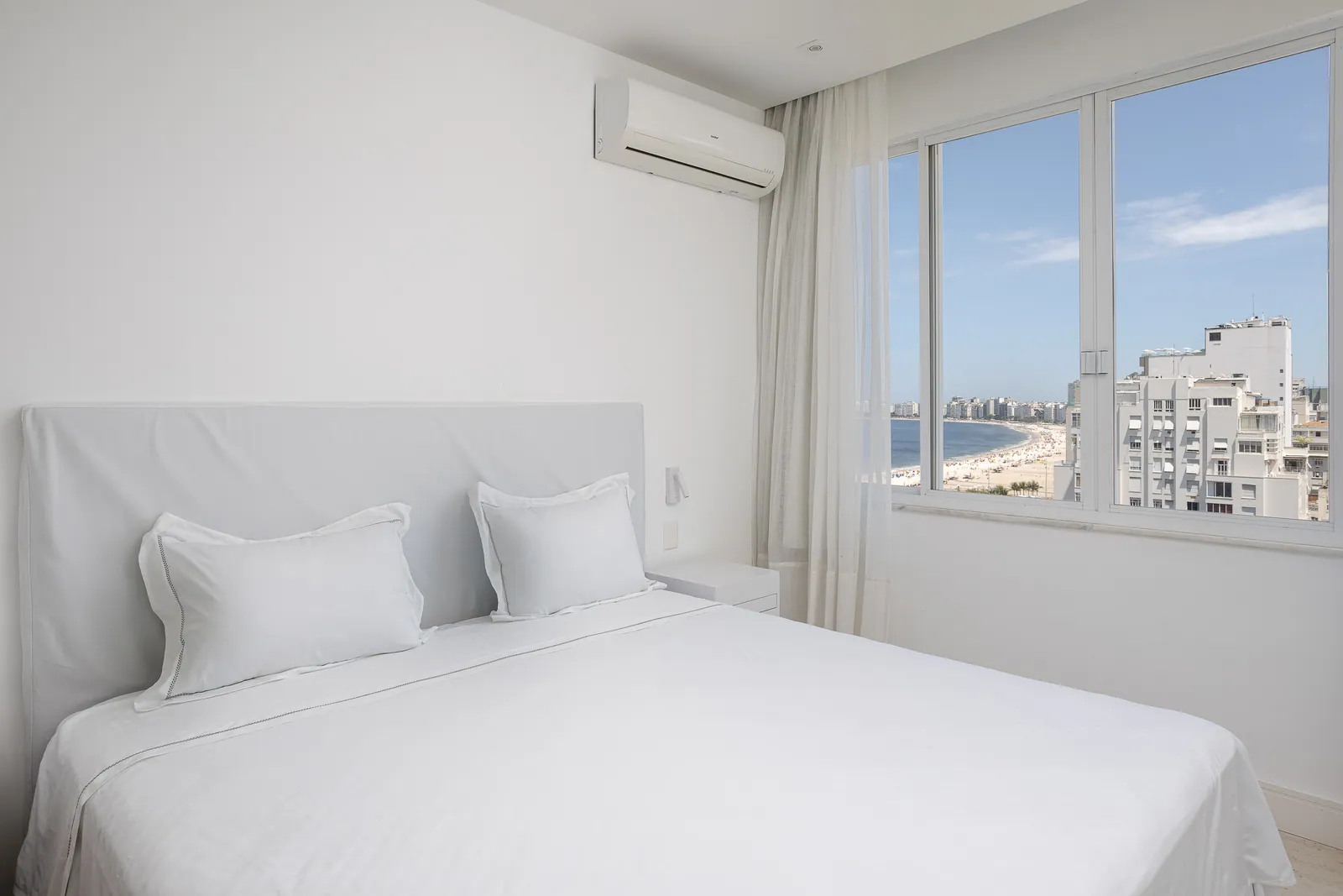 Bedroom window opening onto the beach