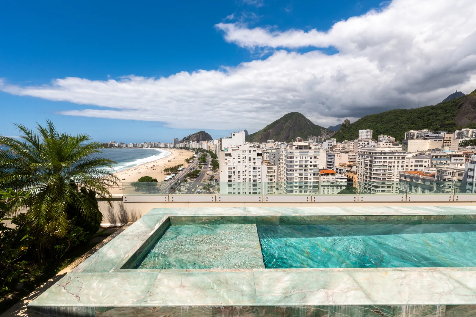 Pool on the terrace above the full sweep of Copacabana beach