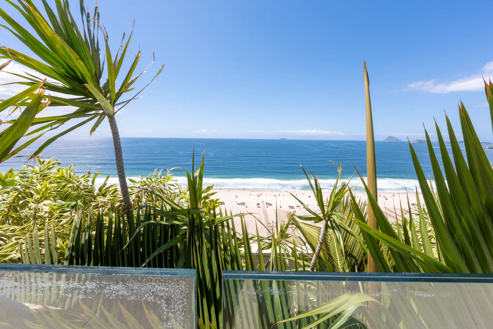 The beach glimpsed through the terrace planting